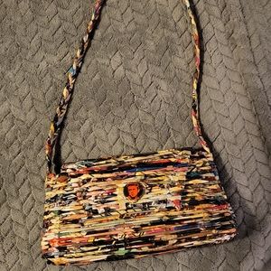 Handbag made out of magazine weaved together with James Dean button